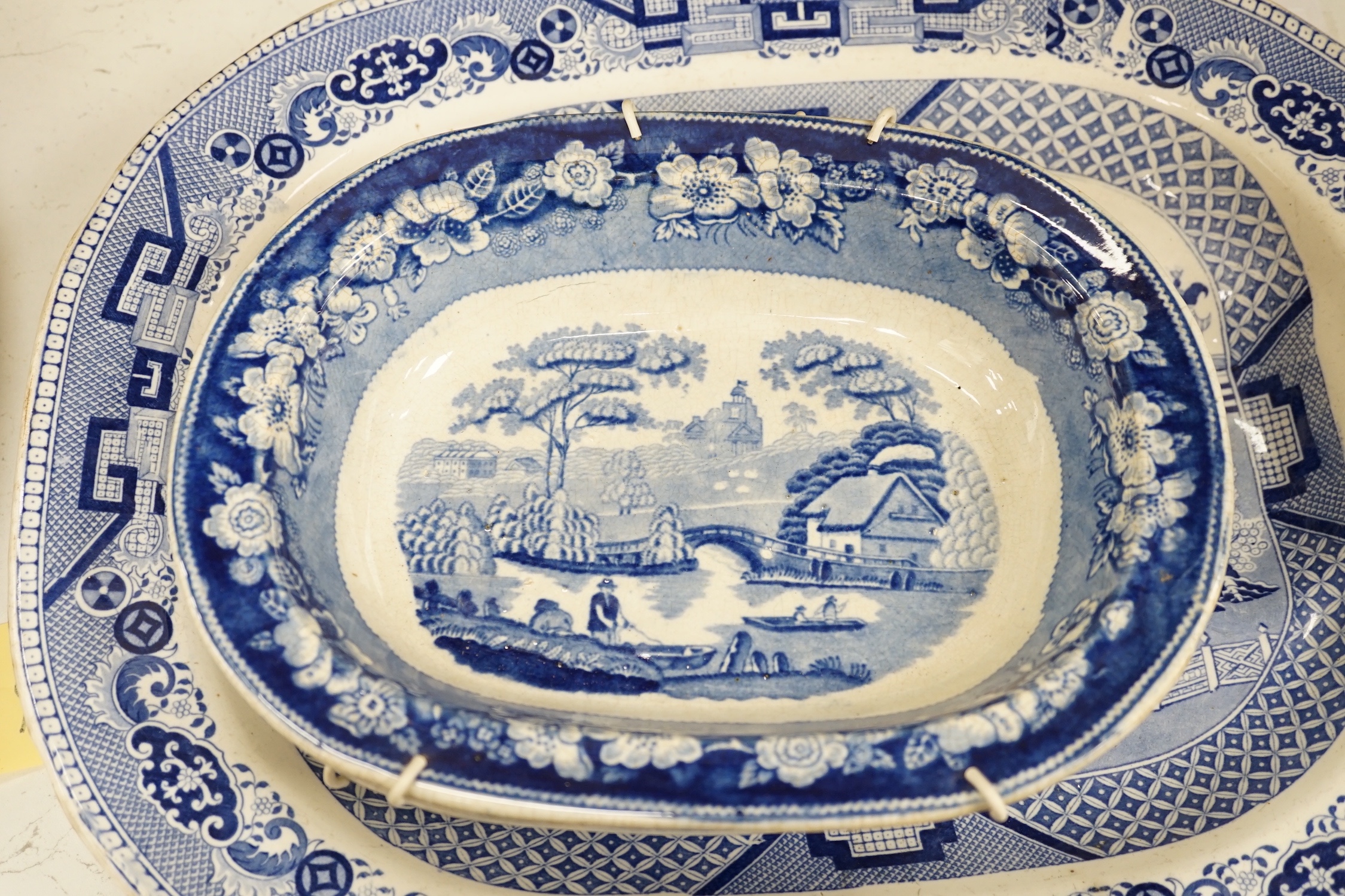 A 19th century blue and white meat platter and four similar dishes